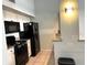 Modern kitchen with black appliances and granite countertops at 101 N Hill S Ave # 7, Deland, FL 32724