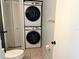Stackable washer and dryer in a small laundry room at 101 N Hill S Ave # 7, Deland, FL 32724