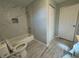 Renovated bathroom with bathtub, toilet, and updated fixtures at 1020 Bobbie Lee Dr, Daytona Beach, FL 32117