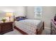 Bedroom with a double bed and dark wood furniture at 1029 River Otter Way, Deland, FL 32720