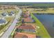 Community view, showing houses near the golf course and lake at 112 Portofino Blvd, New Smyrna Beach, FL 32168