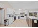 Modern kitchen with white cabinets and granite counters at 1206 Sunshine Tree Blvd, Longwood, FL 32779