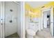 Bright bathroom with white subway tile, shower, and granite vanity at 1601 Ocean Shore Blvd # 1040, Ormond Beach, FL 32176
