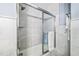 Bathroom with marble shower and tub at 1601 Ocean Shore Blvd # 1040, Ormond Beach, FL 32176