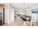 Bright dining area with farmhouse table and ocean view at 1601 Ocean Shore Blvd # 1040, Ormond Beach, FL 32176