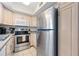 Stainless steel appliances and light wood cabinets at 1601 Ocean Shore Blvd # 1040, Ormond Beach, FL 32176