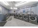 Shared laundry facility with modern washing machines and dryers at 1601 Ocean Shore Blvd # 1040, Ormond Beach, FL 32176