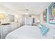 Comfortable Primary suite with dresser and en-suite bathroom at 1601 Ocean Shore Blvd # 1040, Ormond Beach, FL 32176