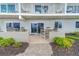 Private patio with table and chairs, perfect for outdoor dining at 1601 Ocean Shore Blvd # 1040, Ormond Beach, FL 32176