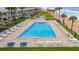 Relaxing community pool with plenty of lounge chairs at 1601 Ocean Shore Blvd # 1040, Ormond Beach, FL 32176