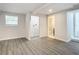 Basement bedroom with grey flooring, laundry closet, and bathroom access at 1604 Carmen Ave, Daytona Beach, FL 32117