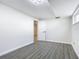 Simple basement bedroom with grey flooring and an open doorway at 1604 Carmen Ave, Daytona Beach, FL 32117