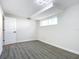 Spacious basement bedroom with grey flooring and plenty of natural light at 1604 Carmen Ave, Daytona Beach, FL 32117