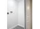 Small basement laundry room with vinyl flooring and white walls at 1604 Carmen Ave, Daytona Beach, FL 32117