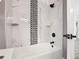 Bathroom with marble and checkered tile design at 1604 Carmen Ave, Daytona Beach, FL 32117