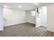 Spacious bedroom with grey vinyl flooring and an adjacent bathroom at 1604 Carmen Ave, Daytona Beach, FL 32117