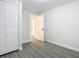 Bedroom with grey vinyl flooring and an open door to another room at 1604 Carmen Ave, Daytona Beach, FL 32117