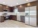 Modern kitchen with stainless steel appliances and dark cabinetry at 1604 Carmen Ave, Daytona Beach, FL 32117