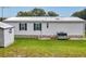 White single-wide mobile home with metal roof and AC unit at 187 Terra Alta Dr, Debary, FL 32713