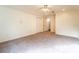 Bright and airy bedroom with carpet flooring and access to upper level at 1907 Enterprise Osteen Rd, Deltona, FL 32738