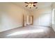 Well-lit bedroom featuring carpet floors and double door closet at 1907 Enterprise Osteen Rd, Deltona, FL 32738