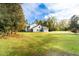 Two-story house with gray siding, two-car garage, and large yard at 1907 Enterprise Osteen Rd, Deltona, FL 32738