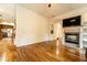 Living room with hardwood floors, fireplace, and built-in shelving at 1907 Enterprise Osteen Rd, Deltona, FL 32738