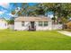 Charming single-story home with a lush green lawn and welcoming curb appeal at 1915 James St, South Daytona, FL 32119