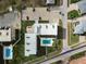 Aerial view showing condo building, pool, and parking at 2294 Ocean Shore Blvd # 401, Ormond Beach, FL 32176
