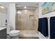 Bathroom with walk-in shower and tile surround at 2294 Ocean Shore Blvd # 401, Ormond Beach, FL 32176