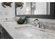 Double vanity bathroom with marble countertop at 2294 Ocean Shore Blvd # 401, Ormond Beach, FL 32176
