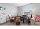 Small dining area with glass table and four chairs at 2294 Ocean Shore Blvd # 401, Ormond Beach, FL 32176