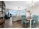 Dining area with teal chairs and ocean view at 2294 Ocean Shore Blvd # 401, Ormond Beach, FL 32176