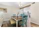 Bright dining room features a table with seating for four and a view into the kitchen at 2294 Ocean Shore Blvd # 401, Ormond Beach, FL 32176