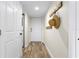 Bright entryway with wood-look floors and coat rack at 2294 Ocean Shore Blvd # 401, Ormond Beach, FL 32176