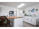 Small kitchenette with white cabinets and wood countertop at 2294 Ocean Shore Blvd # 401, Ormond Beach, FL 32176