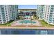 Aerial view of community pool and building at 231 Riverside Dr # 701, Holly Hill, FL 32117