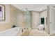 Bathroom with soaking tub, walk-in shower, and toilet at 231 Riverside Dr # 701, Holly Hill, FL 32117