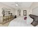 King bed in bedroom with large window and city views at 231 Riverside Dr # 701, Holly Hill, FL 32117