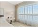 Bedroom with nightstand and window with sheer curtains at 231 Riverside Dr # 701, Holly Hill, FL 32117