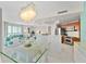 Open concept dining room with kitchen and living room access at 231 Riverside Dr # 701, Holly Hill, FL 32117