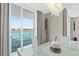 Modern glass dining table with water views at 231 Riverside Dr # 701, Holly Hill, FL 32117