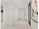 Bright entryway with modern door and artwork at 231 Riverside Dr # 701, Holly Hill, FL 32117