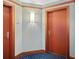 Hallway with two doors and wood trim at 231 Riverside Dr # 701, Holly Hill, FL 32117