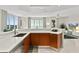 Modern kitchen with island and stainless steel appliances at 231 Riverside Dr # 701, Holly Hill, FL 32117