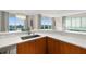 Modern kitchen with stainless steel appliances and granite countertop at 231 Riverside Dr # 701, Holly Hill, FL 32117