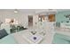 Open concept living and kitchen area with breakfast bar and modern appliances at 231 Riverside Dr # 701, Holly Hill, FL 32117