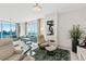 Bright living room with water views and stylish furniture at 231 Riverside Dr # 701, Holly Hill, FL 32117