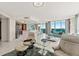 Open living space with kitchen, seating area, and water views at 231 Riverside Dr # 701, Holly Hill, FL 32117