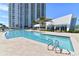 Resort-style pool with surrounding patio at 231 Riverside Dr # 701, Holly Hill, FL 32117